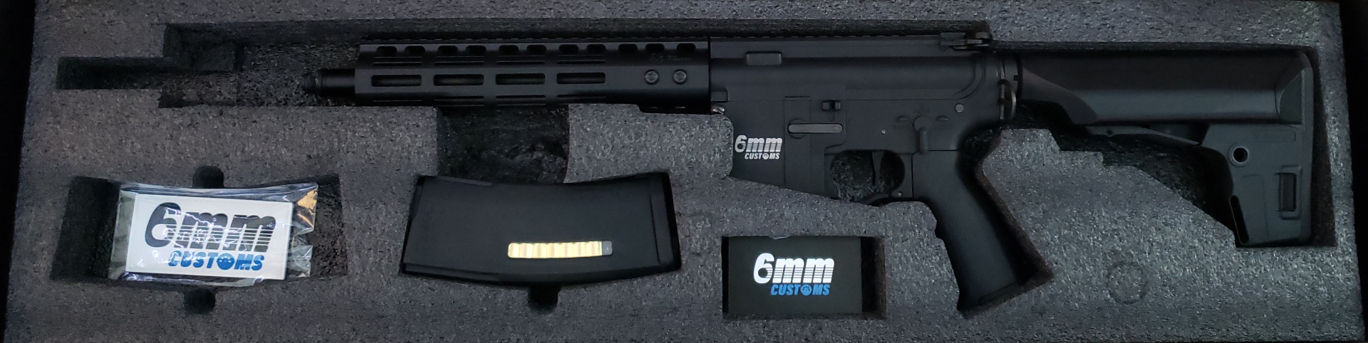 Custom airsoft AEG with exposed gearbox internals