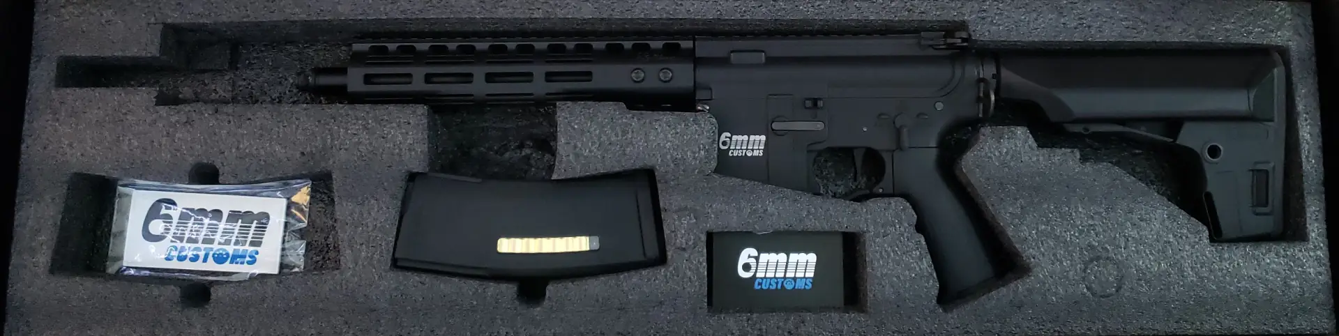Custom airsoft AEG with exposed gearbox internals